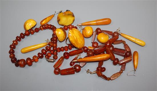 A small group of assorted amber jewellery, including ring and necklaces.